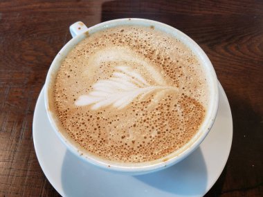 Latte Art ve bir fincan kahve.