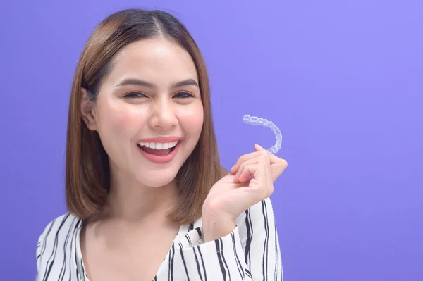 Young Smiling Woman Holding Invisalign Braces Studio Dental Healthcare Orthodontic — Φωτογραφία Αρχείου