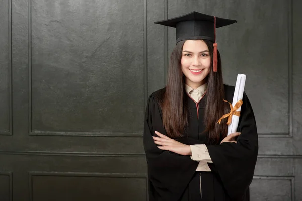 Portrait Young Woman Graduation Gown Smiling Cheering Black Background — Stock Photo, Image