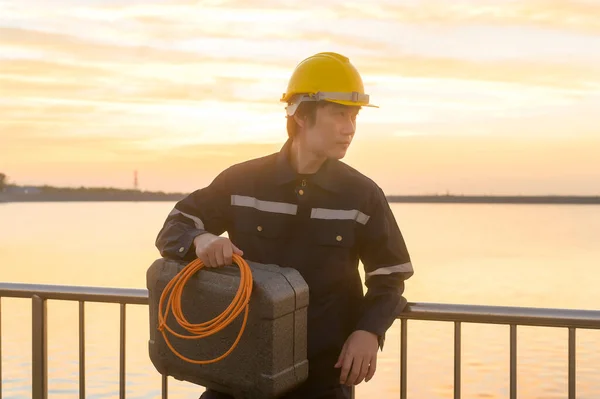 Male Engineer Wearing Protective Helmet Sunset — Foto Stock