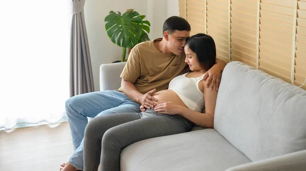 Young Pregnant Woman Husband Embracing Expecting Baby Home — Photo