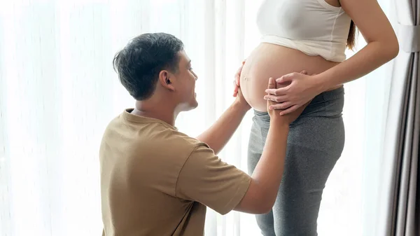 Young Pregnant Woman Husband Embracing Expecting Baby Home — Photo