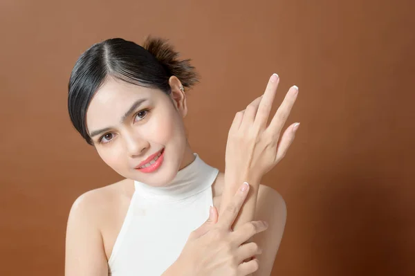 Close Young Woman Hand Applying Cream Brown Background Beauty Skin — Stock Fotó