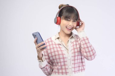 A young beautiful woman wearing headset on white background