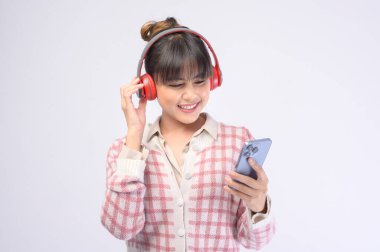 A young beautiful woman wearing headset on white background