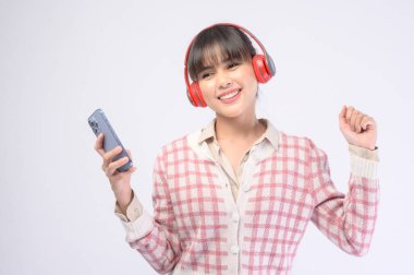 A young beautiful woman wearing headset on white background