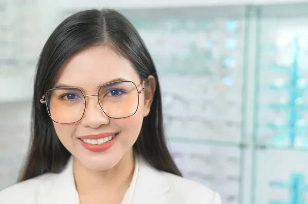 Portrait of ophthalmologist in optical center, eyecare concept.