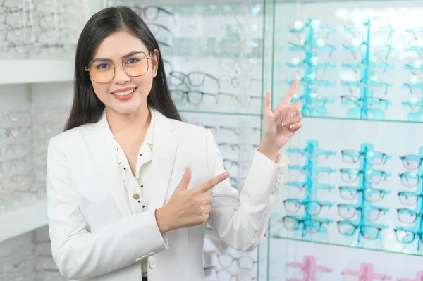 Portrait of ophthalmologist in optical center, eyecare concept.