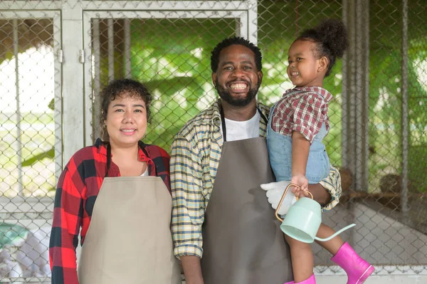 A Happy black agronomist family enjoying and working in farmland, agriculture concept