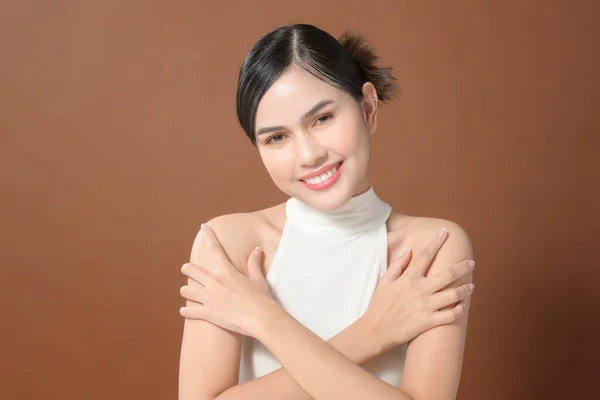 Young Woman Beautiful Face Smiling Touching Her Skin Brown Background — 图库照片