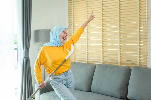 Young Happy Muslim Woman Mopping Vacuum Floor Living Room — Stock fotografie