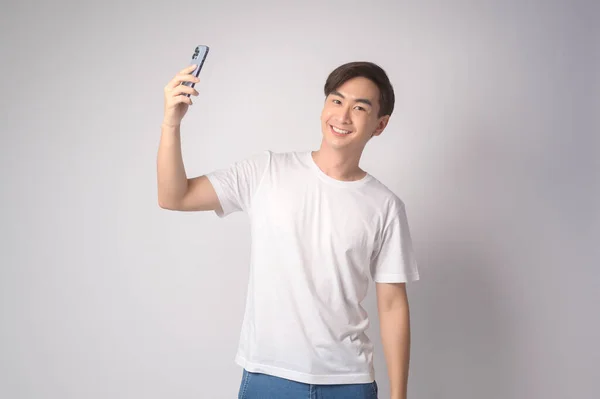 Young Asian Man Using Smartphone White Background Technology Concept — Zdjęcie stockowe