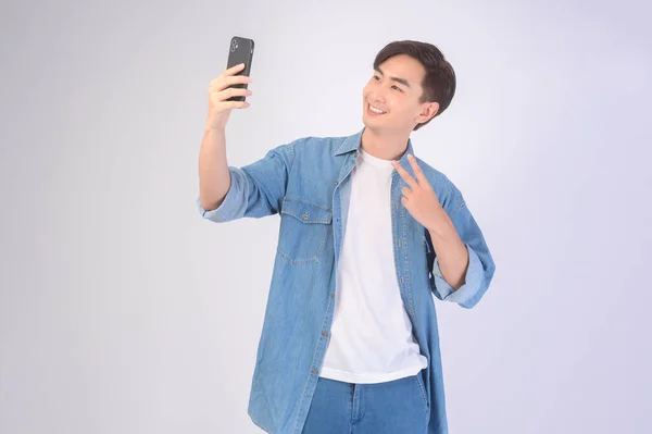 Young Asian Man Using Smartphone White Background Technology Concept — Zdjęcie stockowe