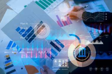 Background of documents with analytics data lying on table 