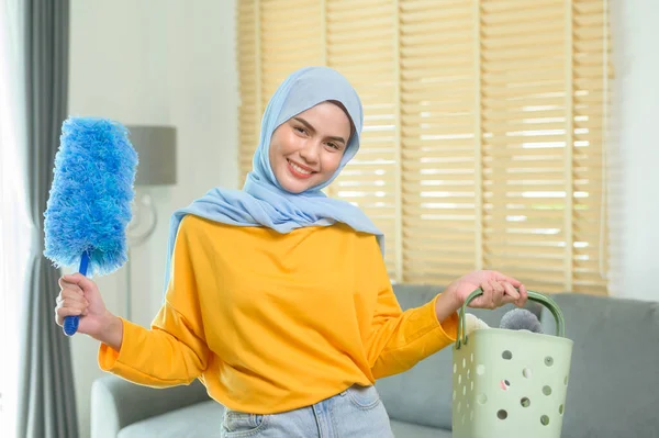 Young Happy Muslim Woman Wearing Yellow Gloves Holding Basket Cleaning — Stockfoto