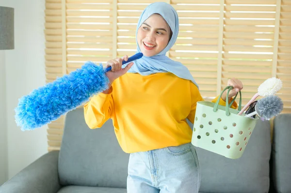 Young Happy Muslim Woman Wearing Yellow Gloves Holding Basket Cleaning — Stockfoto