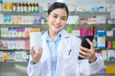 A Female pharmacist counseling customer via video call in a modern pharmacy drugstore.