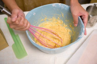 A Close up of Young beautiful woman is baking in her kitchen , bakery and coffee shop business