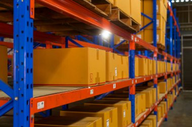 Inventory full of shelves in modern warehouse storage of retail shop.
