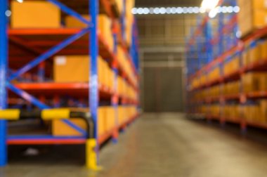 Blurred background of Inventory full of shelves in modern warehouse storage of retail shop.