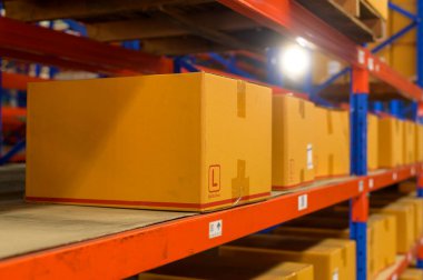 Inventory full of shelves in modern warehouse storage of retail shop.