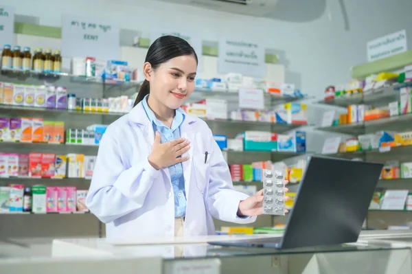 Female Pharmacist Counseling Customer Video Call Modern Pharmacy Drugstore — стоковое фото