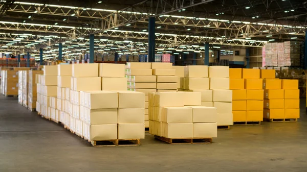 Inventory full of cardboard boxes in modern warehouse storage of retail shop.