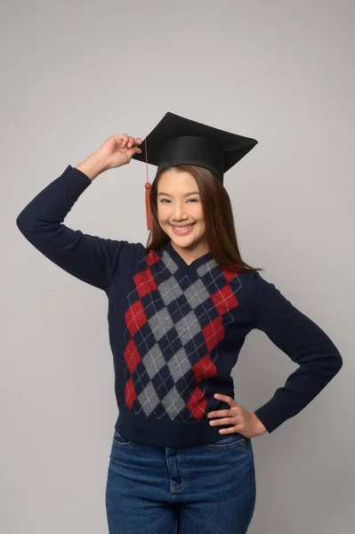 Young Smiling Woman Holding Graduation Hat Education University Concept — Stok fotoğraf