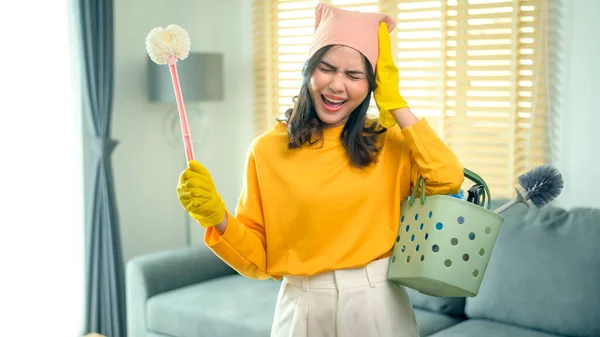 Young Exhausted Tired Housekeeper Wearing Yellow Shirt Living Room — Stockfoto