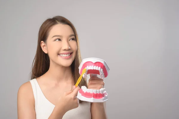 Young Smiling Woman Holding Toothbrush White Background Studio Dental Healthcare — Stok Foto
