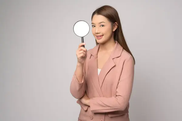 Young Asian Woman Holding Magnifying Glass White Background Analysis Finance — стоковое фото