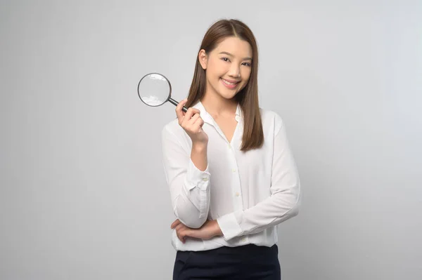 Young Asian Woman Holding Magnifying Glass White Background Analysis Finance — Stock fotografie