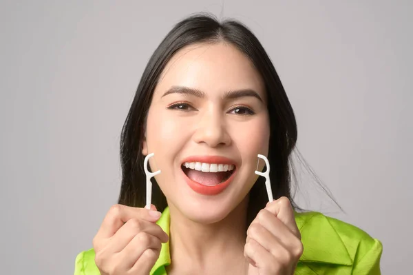 Young Smiling Woman Holding Dental Floss White Background Studio Dental — Zdjęcie stockowe