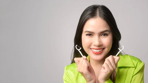 Young Smiling Woman Holding Dental Floss White Background Studio Dental — Zdjęcie stockowe