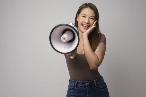 Young Smiling Woman Holding Megaphone White Background Studio — Stockfoto