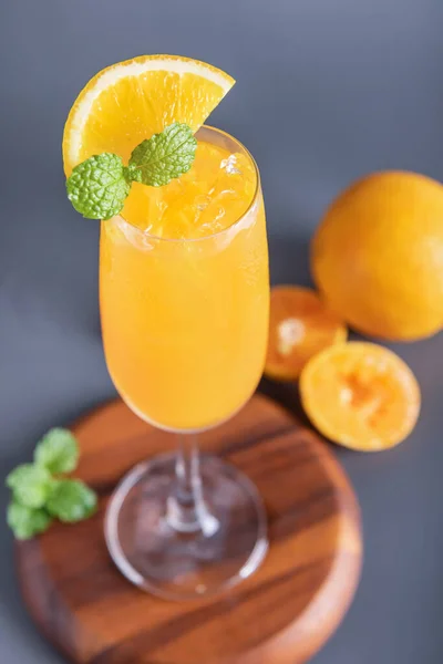 Fresh orange juice in glass with mint, fresh fruits. selective focus.