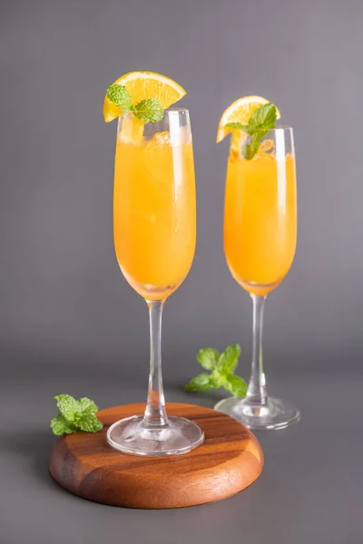 Fresh orange juice in glass with mint, fresh fruits. selective focus.