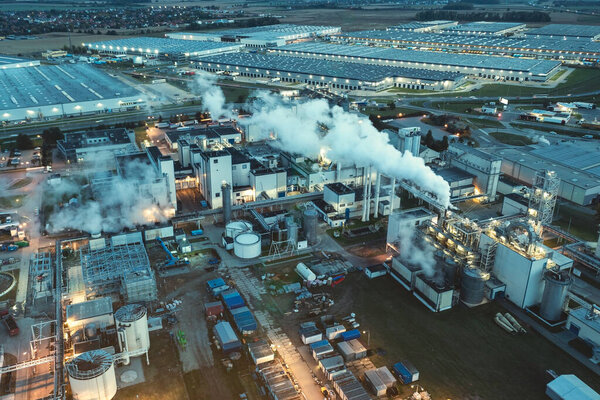 Top view at night on a large number of industrial enterprises for the refining of oil and the production of gasoline.