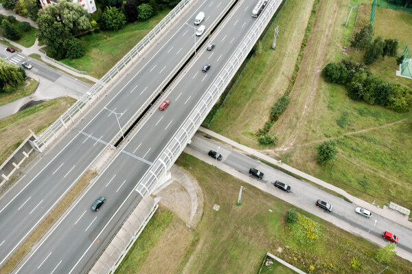 Aerial view of the freeway with various connections. Vehicles travel on the roads. Poland