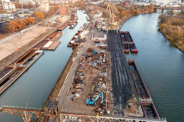 Barges in line on the river awaiting the loading of scrap metal. view from above