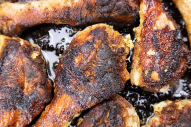 Fried chicken in a pan, chicken legs