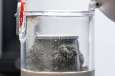 Dirt and dust inside the vacuum cleaner, vacuum cleaner trash can