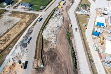 Aerial view of repair work on the road, a lot of machinery doing repair work