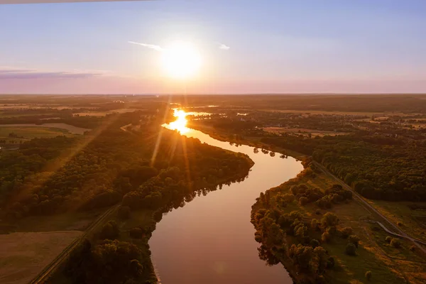 Aerial view of the river in the evening, evening summer landscape in nature