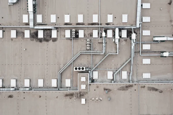 Air conditioning system on the roof of the building, advanced air conditioning and ventilation system, aerial view down the roof of the house, many different ventilation ducts