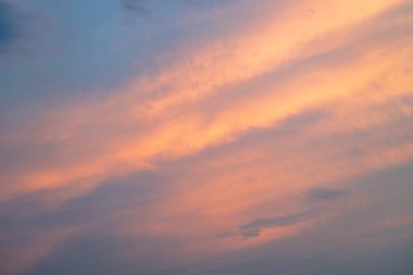 Beautiful bright sunset on the sky, sky with clouds in the evening