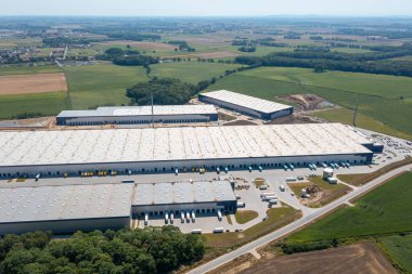 A large warehouse with various goods for an online store, loading and sending goods by land transport, a large warehouse from a height