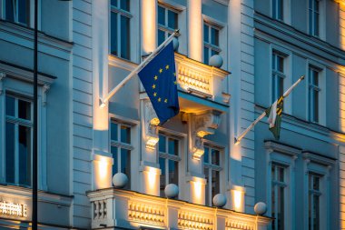 EU flag on government building, illuminated EC flag