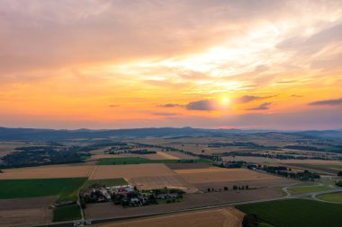 Beautiful golden sunset over wheat field, rural scene, top view