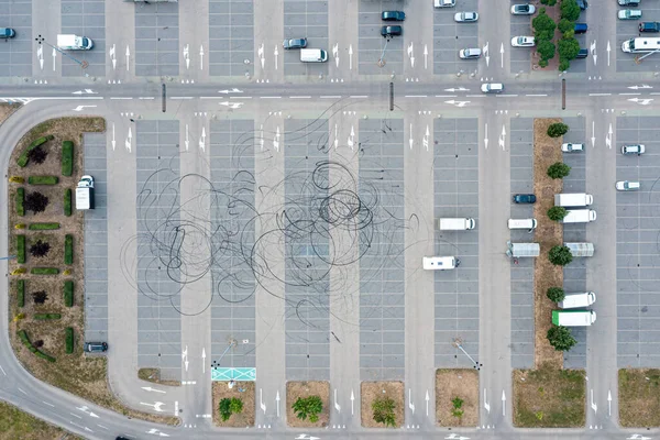 Aerial view of a parking lot near a mall
